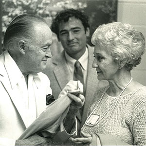 Photo: Bob Hope talking with a woman while Bob Dunning looks on