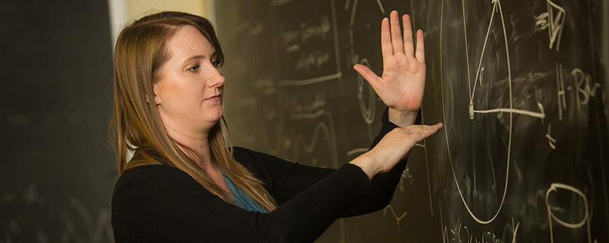 Rachel Houtz, a doctoral candidate in physics at UC Davis, shown here teaching a class, also earned a Master of Science in physics here. (UC Davis)