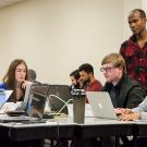 Instructor Nelly Sugira, standing to the right, helps students with a code-stringing exercise at UC Davis Extension's Coding Boot Camp. (Alex Ivaschenko/UC Davis Extension)