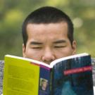 Student reading arboretum