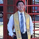 Chinsin Sim poses in front of the telephone booths on campus.