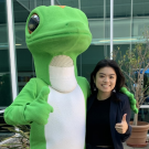 Sociology major Victoria Ha poses with the Geico Gecko during her internship.